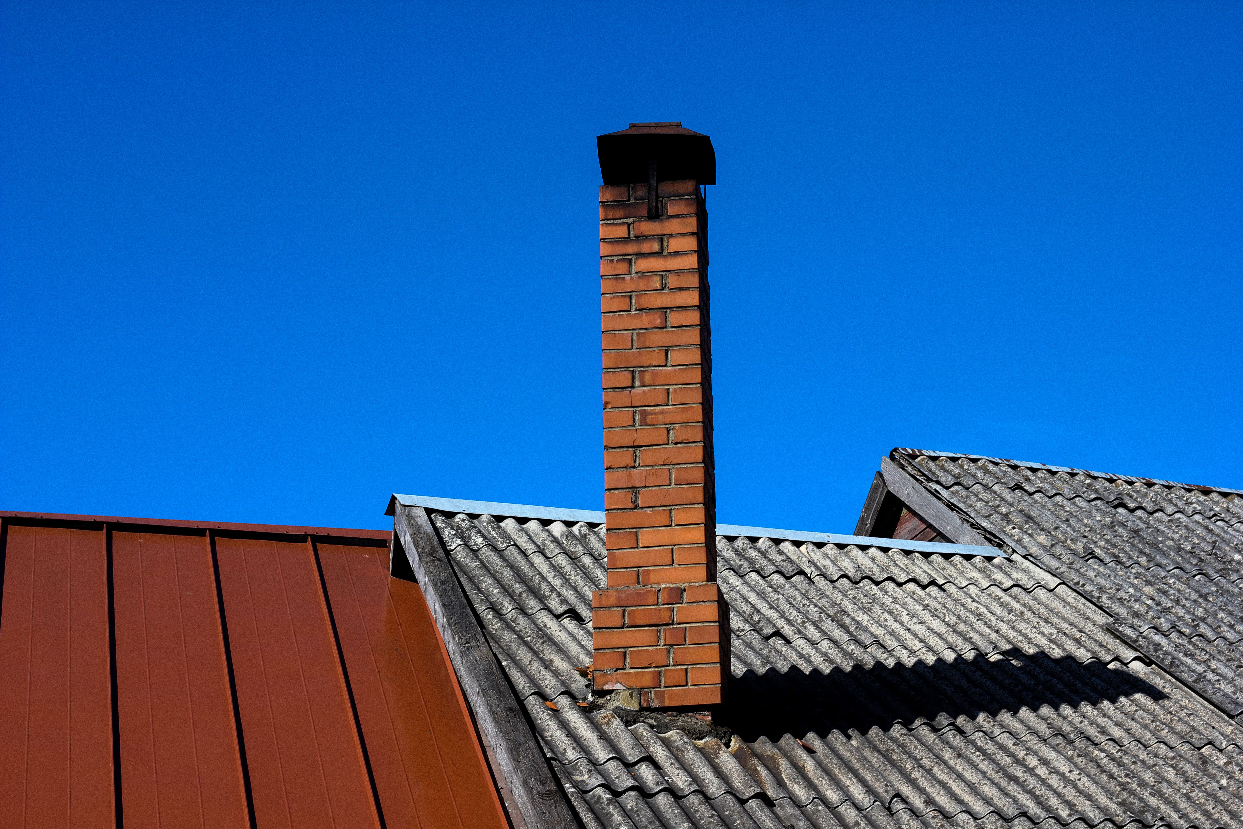 Professional chimney service technician at work