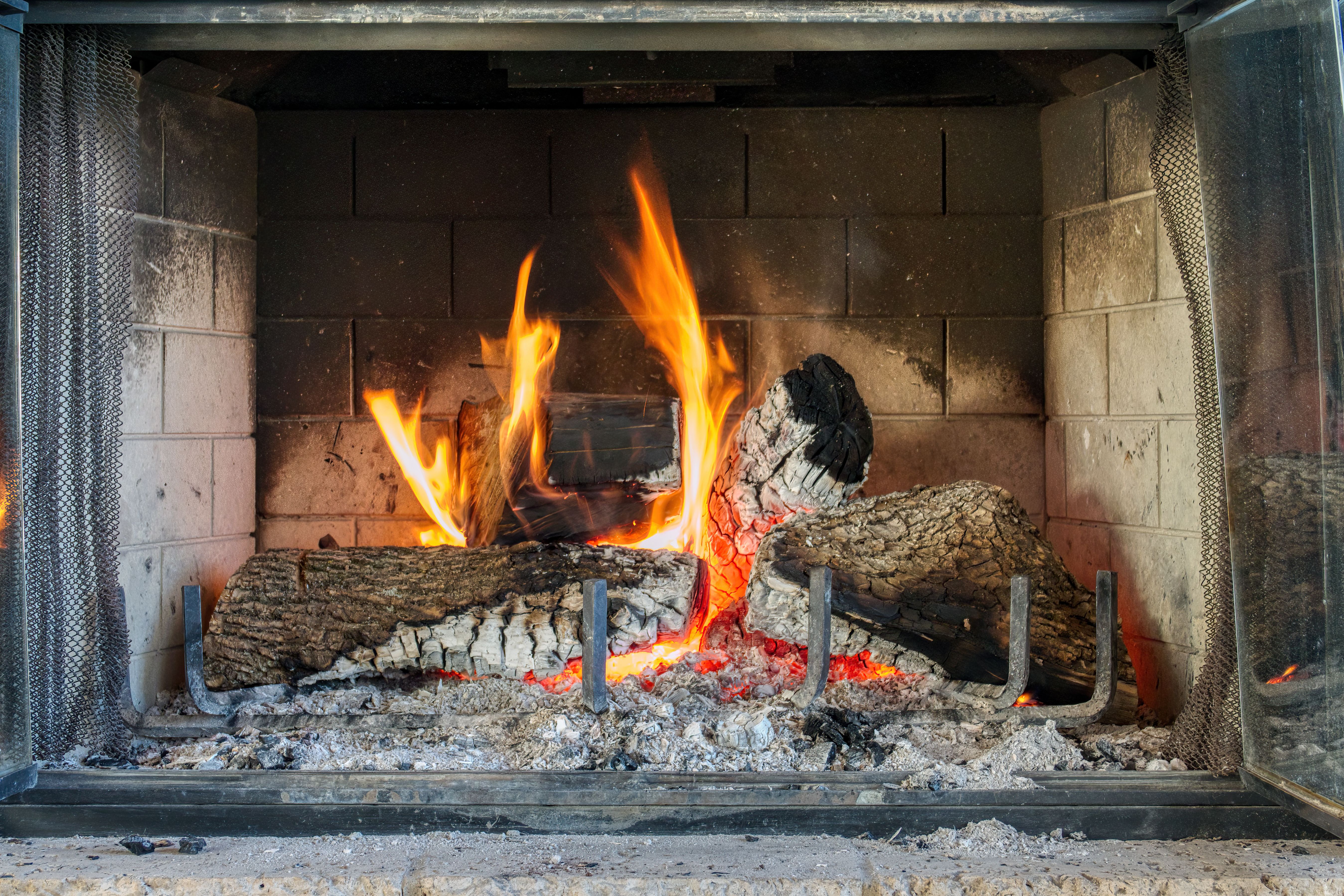 Professional chimney cleaning service in progress